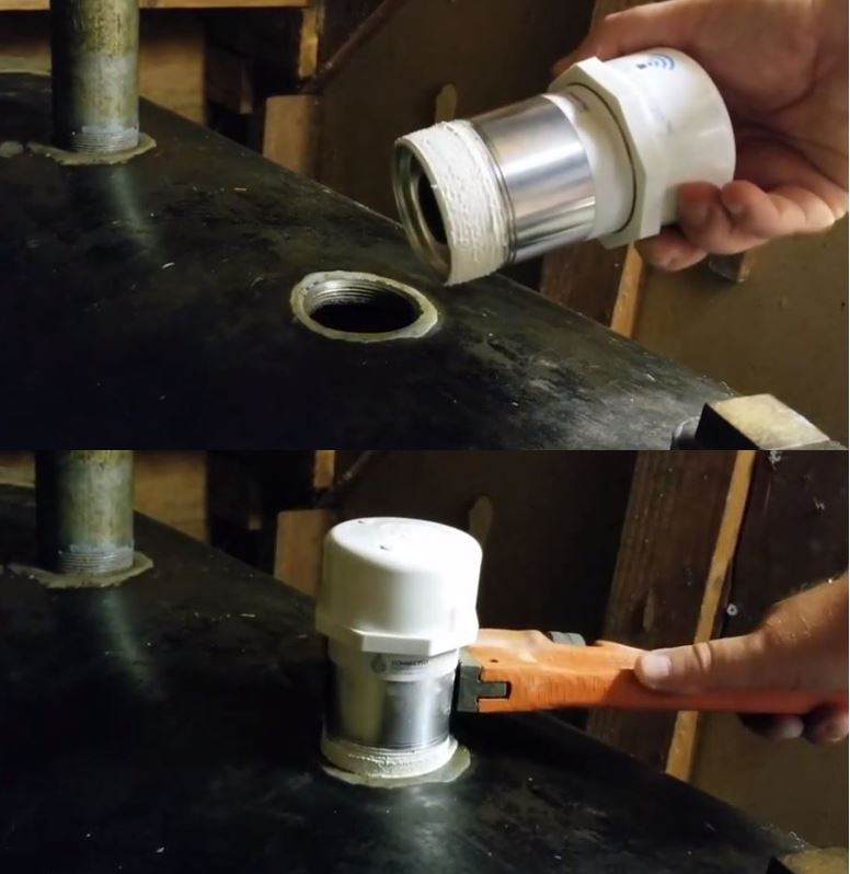 Smart Oil Gauge with pipe dope applied being installed on an oil tank.